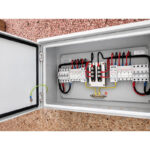 Open view of HONI 2-in 2-out PV DC combiner box with enclosure door and internal wiring